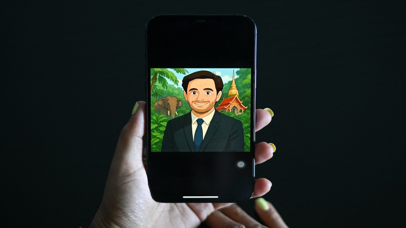 A smartphone displaying an animated character with a background of trees, an elephant, and a temple.