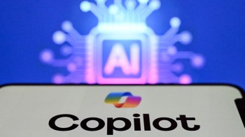 A smartphone displaying the word "Copilot" with an abstract AI circuit background.