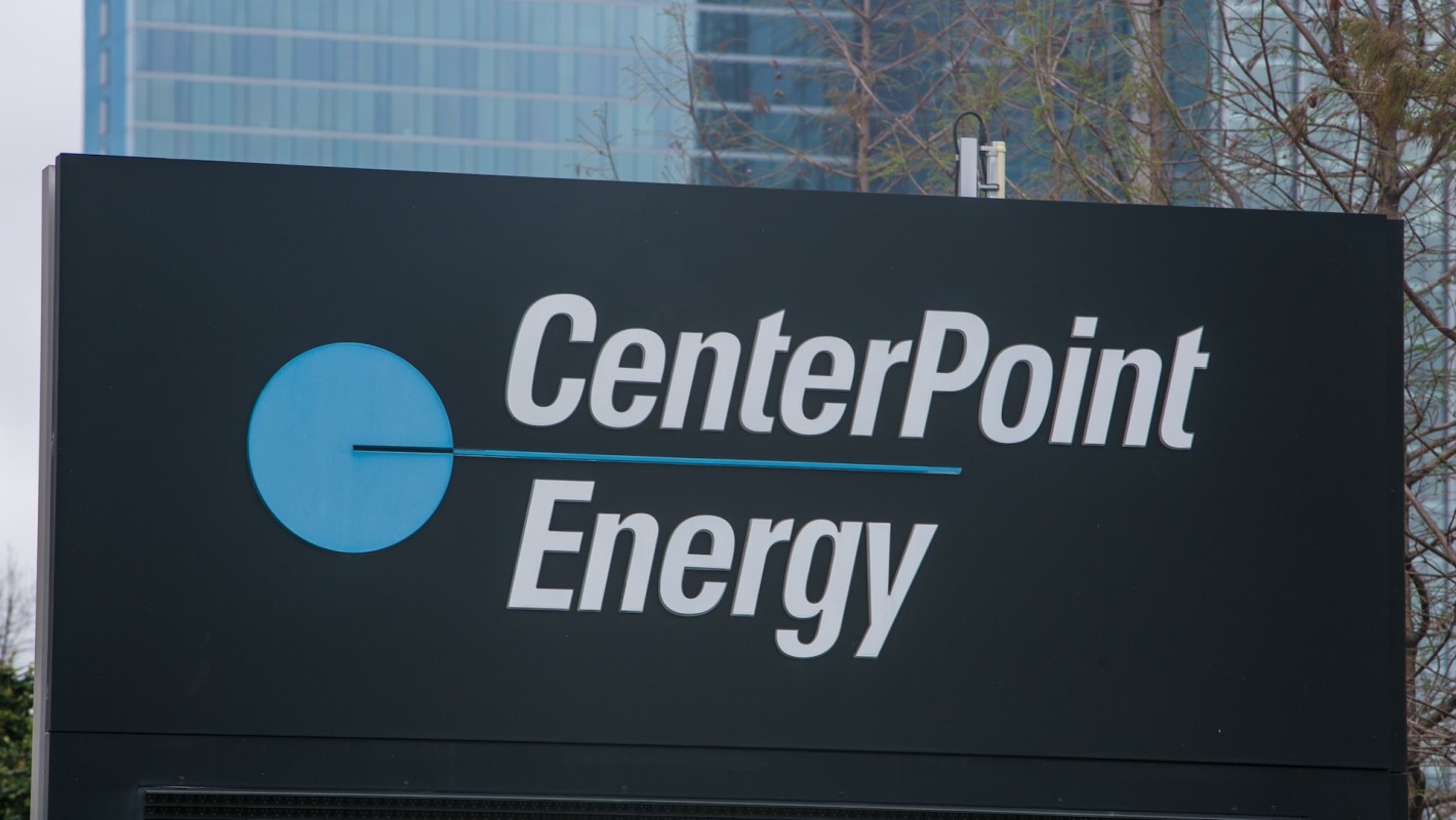 CenterPoint Energy sign with a blue graphic element and text on a dark background.
