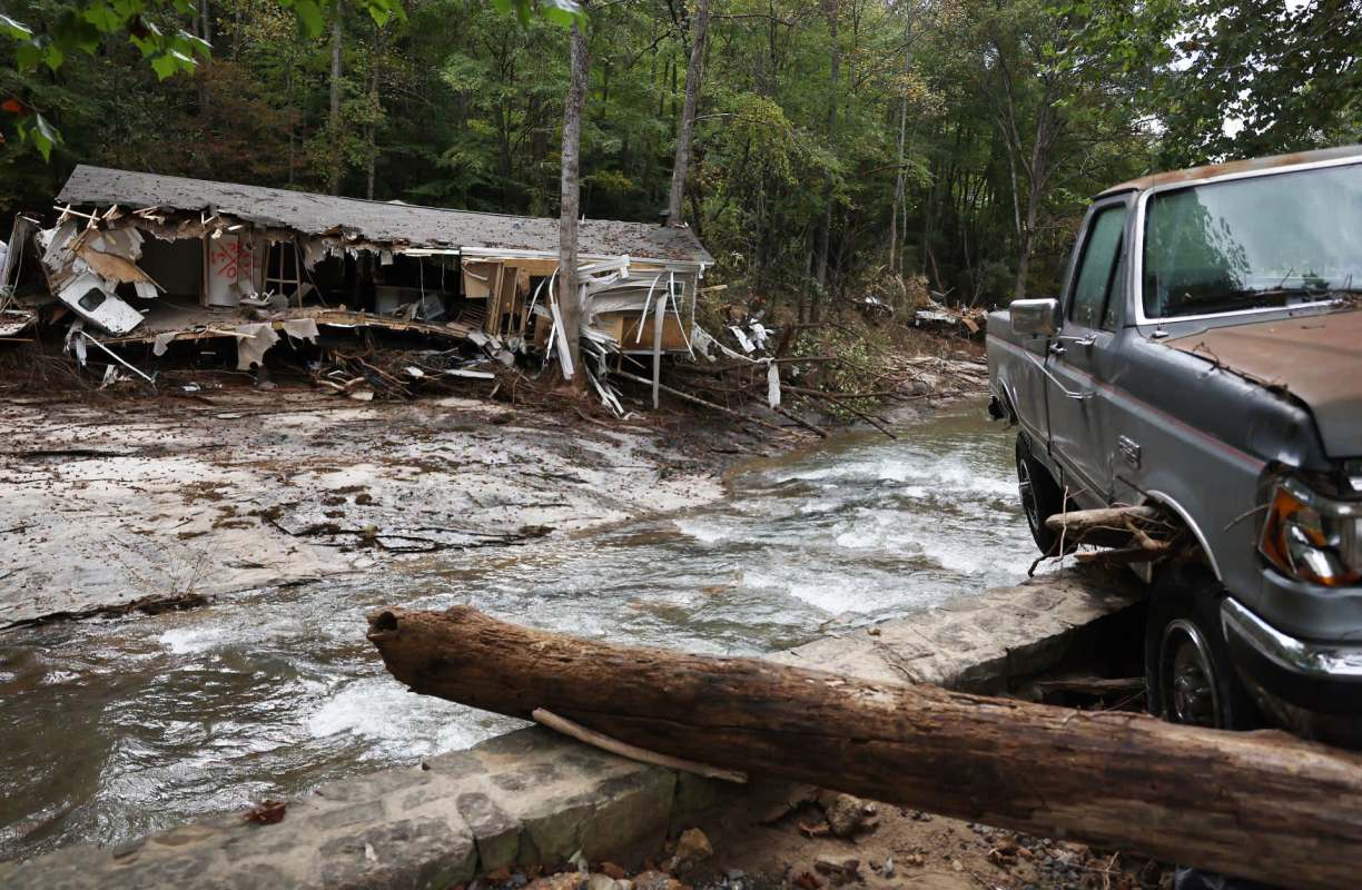 Flooding and housing damage from Hurricane Helene in North Carolina.