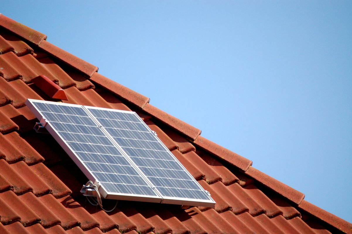 Single solar panel on a roof top