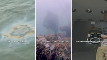 An oil slick reflects colors on the water's surface, while divers assess a shipwreck and a person holds a camera.