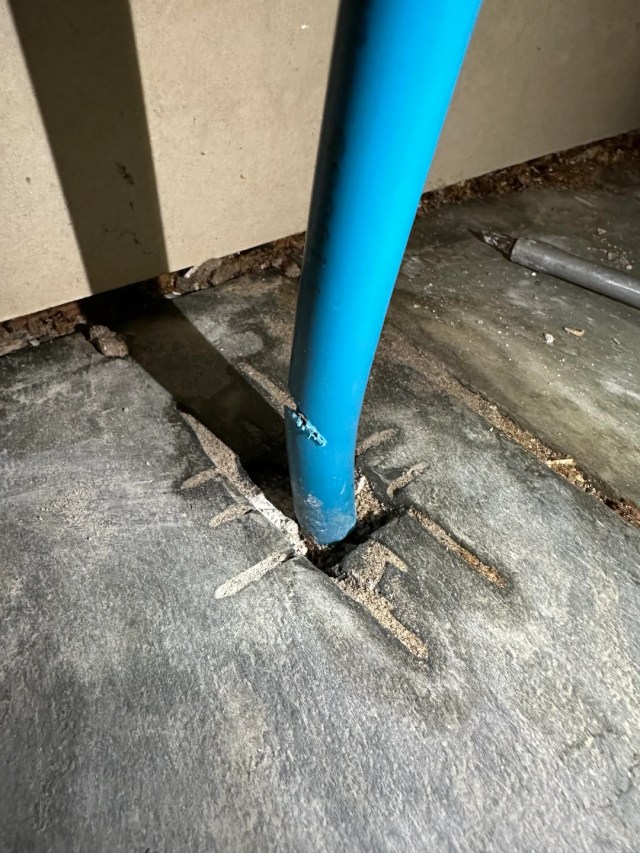 A blue pipe with a hole.