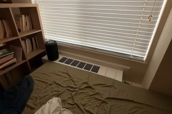 An AC vent under a window.