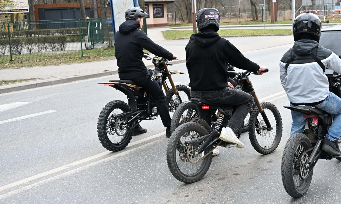 Three people on electric bikes.