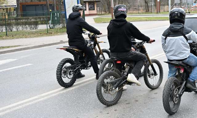 Three people on electric bikes.