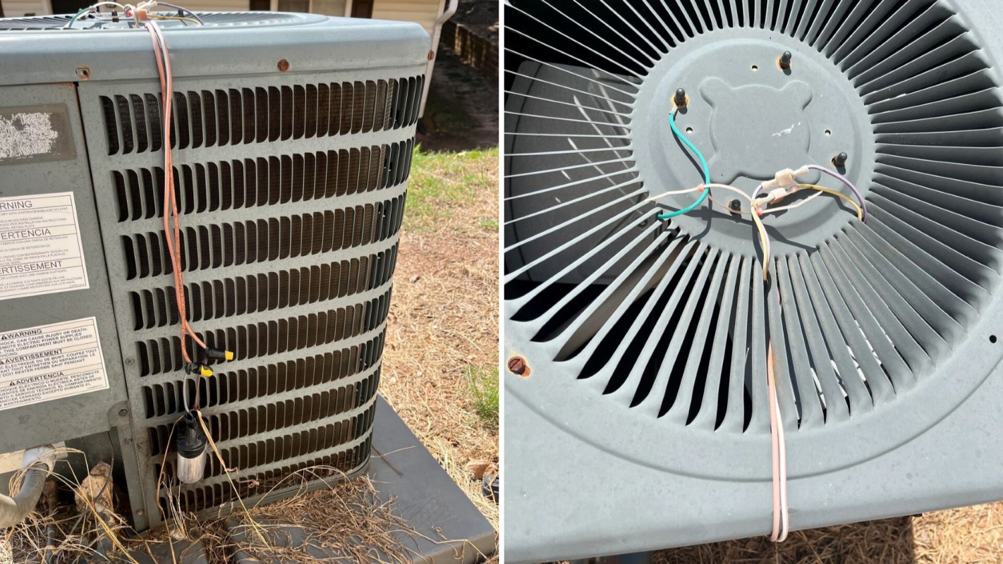 An outdoor air conditioning compressor unit that is broken with dangling wires and the top part of the AC