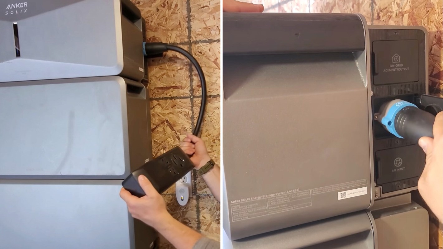 A person connects a power cord to an Anker SOLIX energy storage system on a wall.