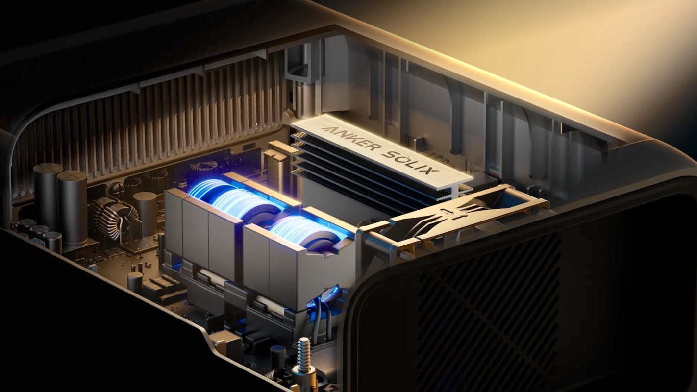 An interior view of a device showcasing cooling components and circuitry, featuring an Anker label.