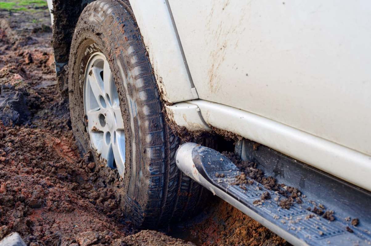 A truck tire stuck in the mud