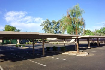 A partially shaded parking lot.