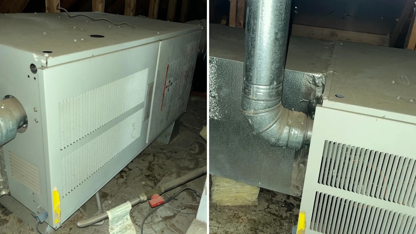 A heating unit and ductwork in an attic, with exposed wiring and plumbing.