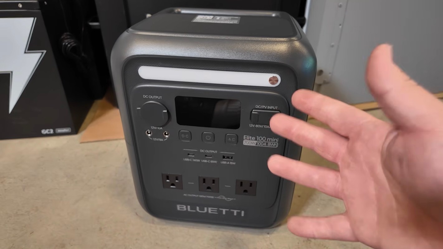 A portable power station with multiple output ports and a digital display.