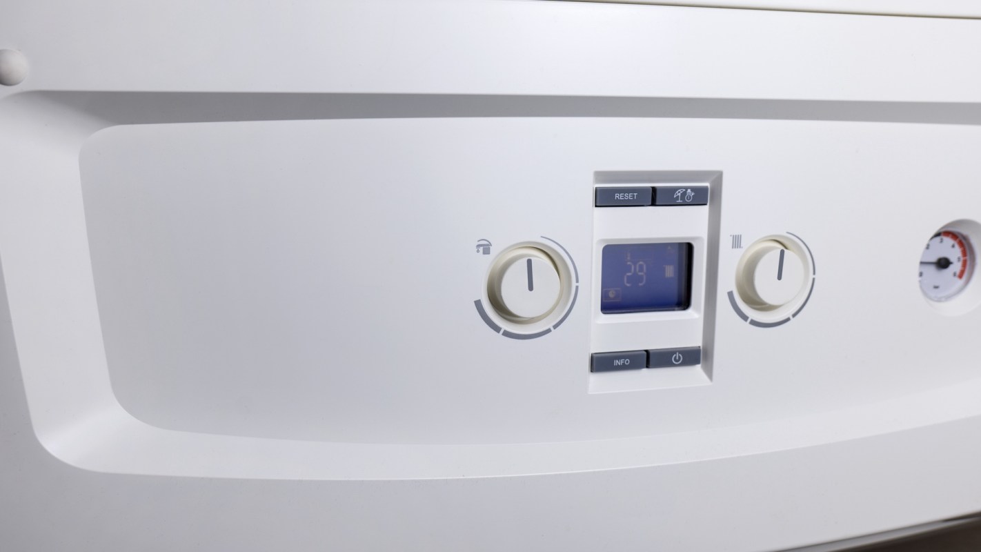 A control panel with buttons and a digital display showing a temperature of 29 degrees.