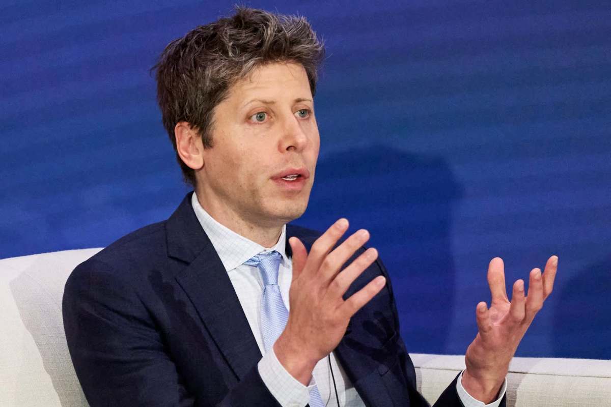 Open AI CEO Sam Altman gesturing with his hands.