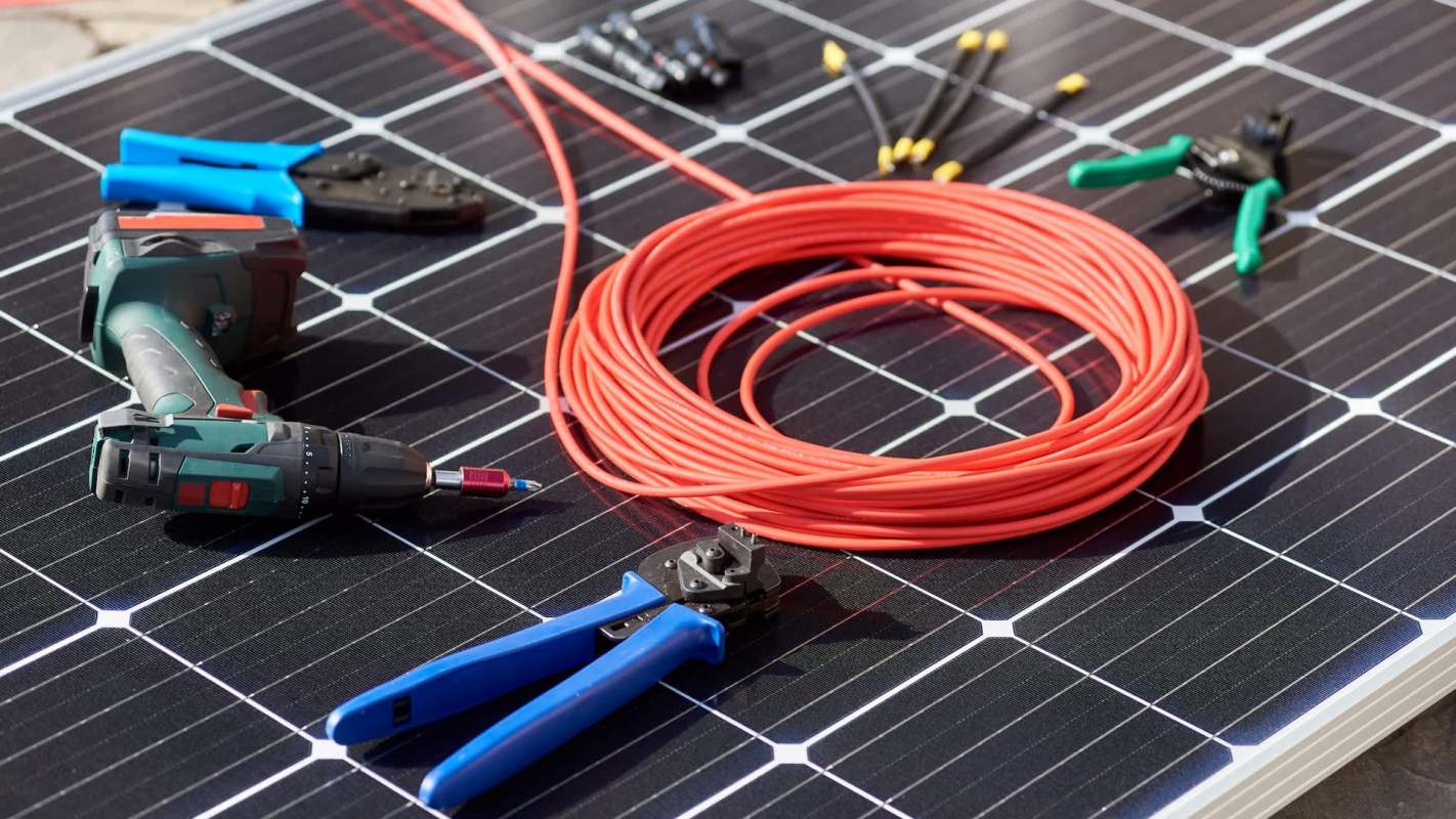 Tools and equipment used for solar panel installation on a solar panel surface.