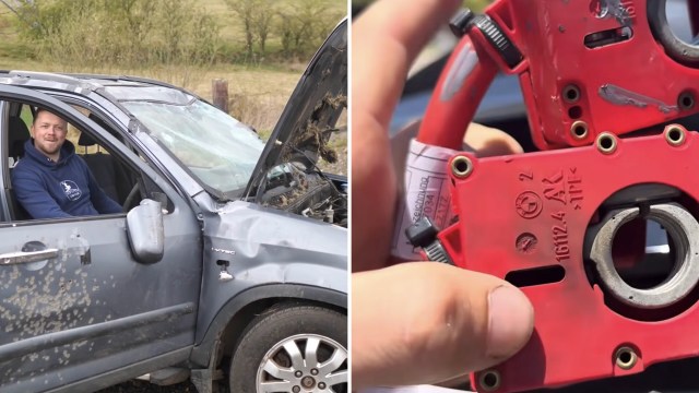 A man in a damaged car with the hood open.