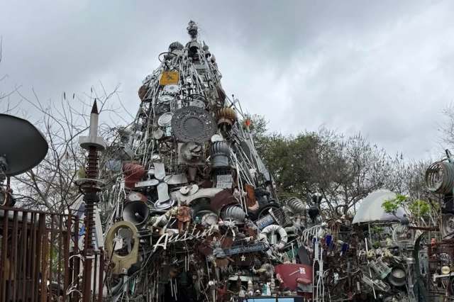Texas homeowner spent decades building a 35-foot 'Cathedral of Junk' from tires, crutches, and carts