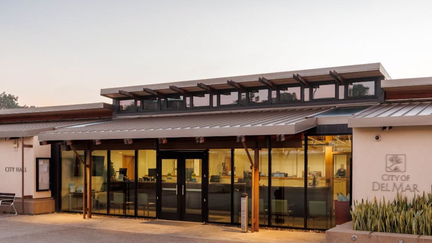A city hall building with a modern design and large glass windows.