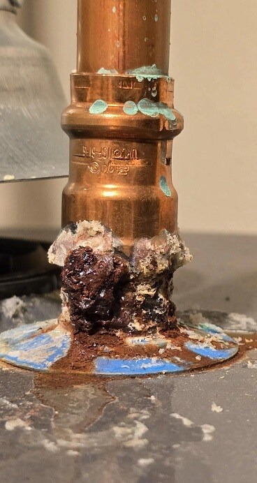 Water heater pipes with corrosion
