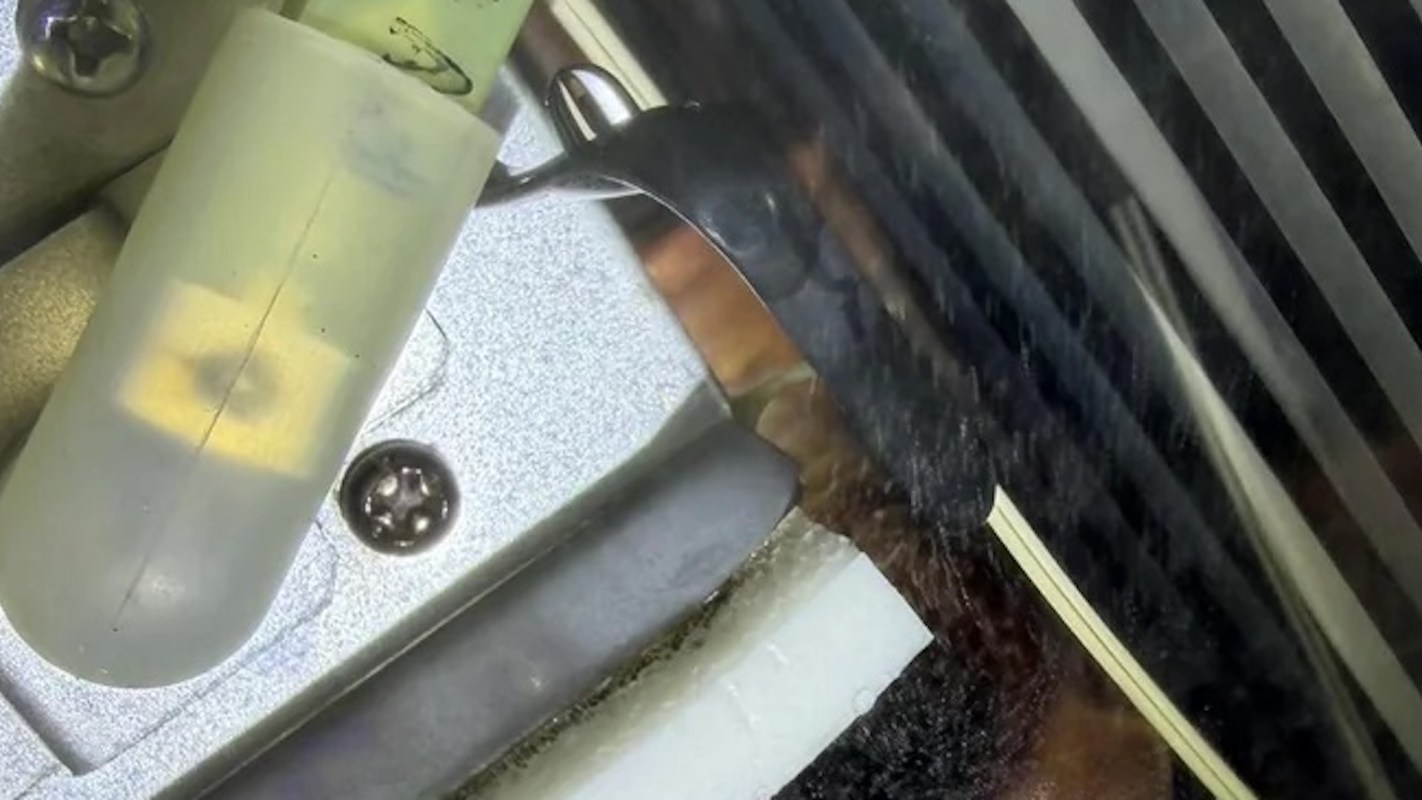 A pinhole leak in a tankless water heater.