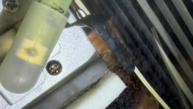 A pinhole leak in a tankless water heater.