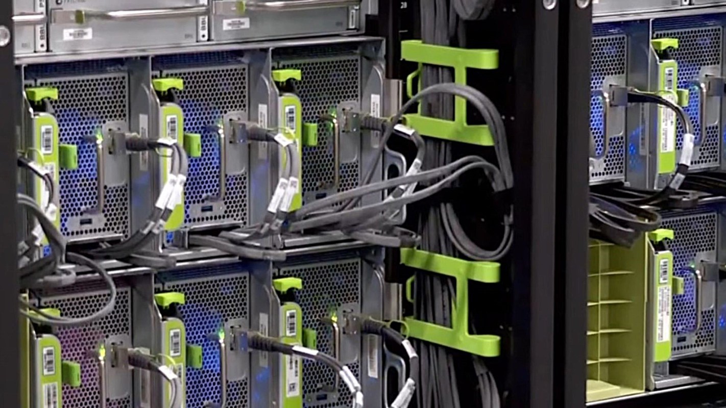 A server rack with multiple servers and tangled cables.