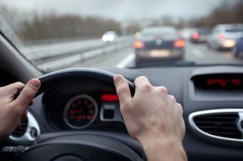 A person driving a car.