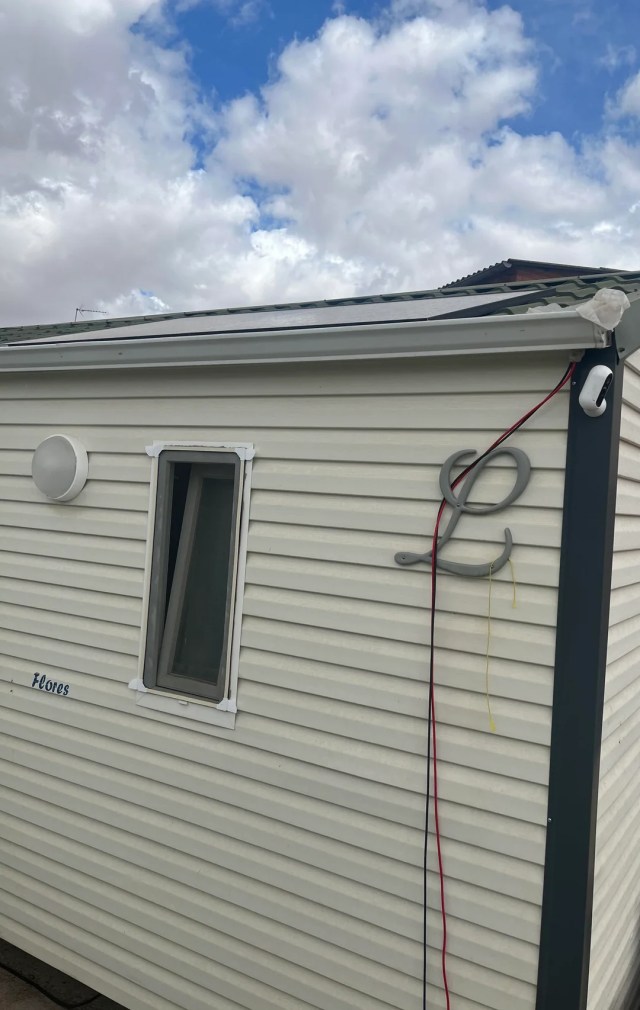 Outdoor cables hooked up to a house.