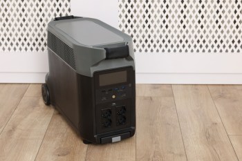 An ecoflow invertor next on a wooden floor