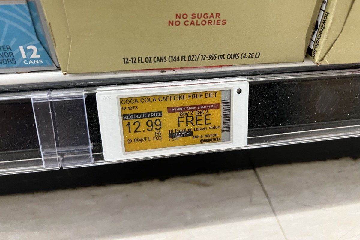 An electronic shelf label displays the price of a pack of sodas in a grocery store
