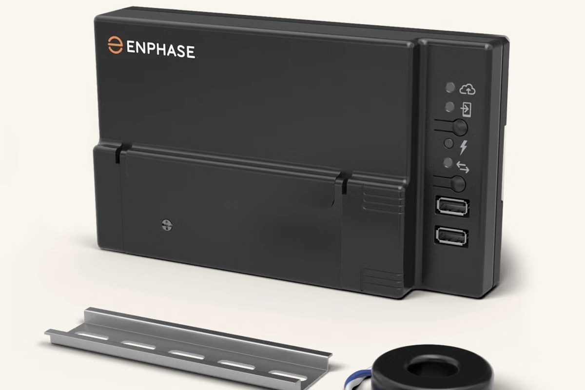 A black Enphase device with USB ports and LED indicator lights, accompanied by a metal mounting bracket and a circular component.