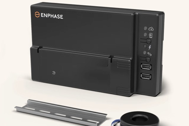 A black Enphase device with USB ports and LED indicator lights, accompanied by a metal mounting bracket and a circular component.