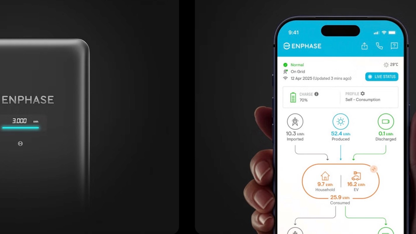 A smartphone displaying an Enphase energy management app next to a Enphase charging device.