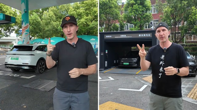 A man stands outside an electric vehicle charging station, gesturing with his hands.