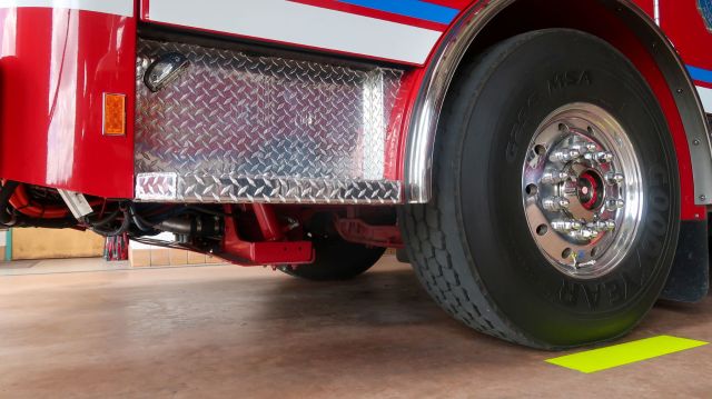 A firetruck parked in a fire station.