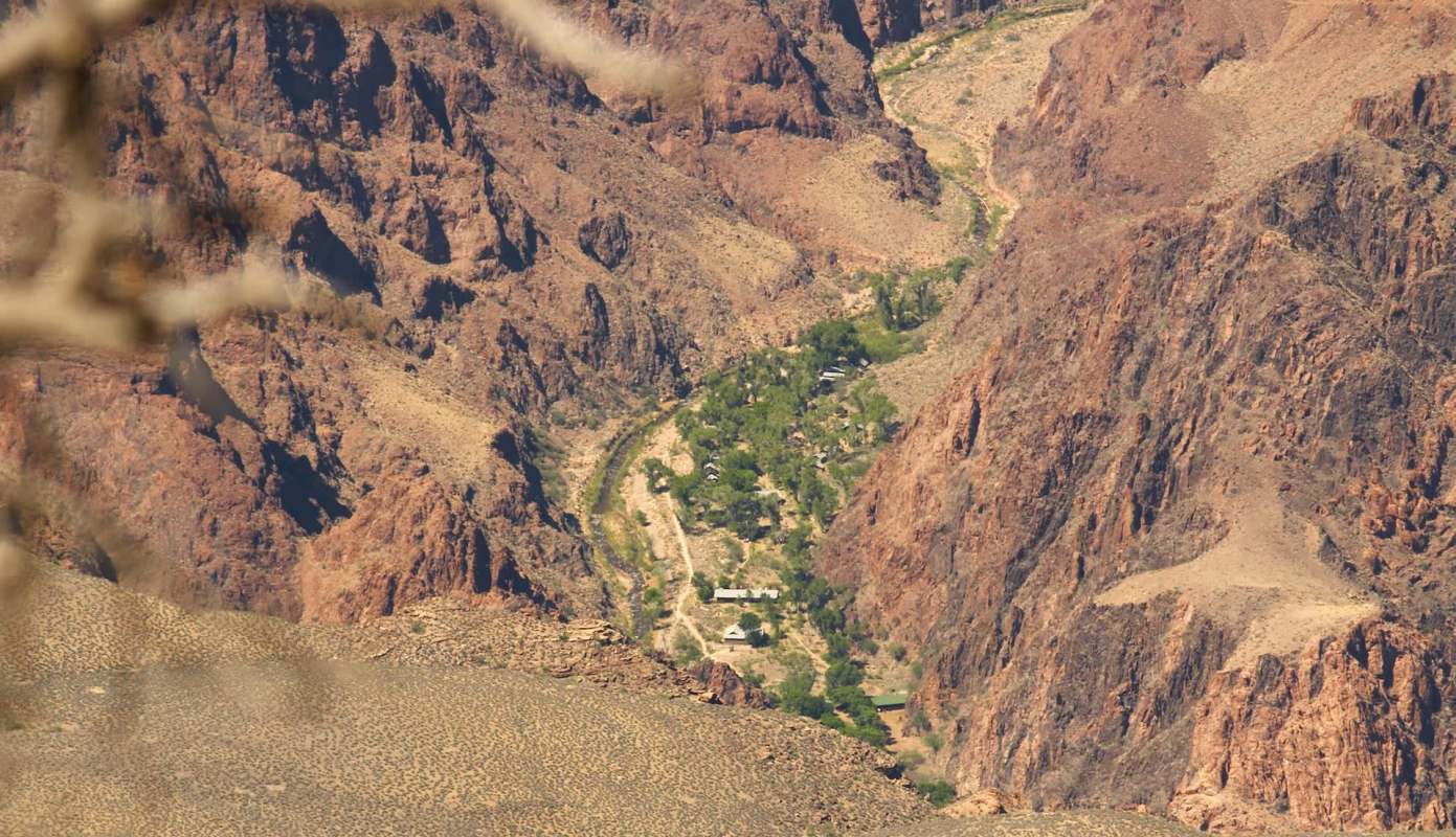The Grand Canyon's Phantom Ranch surrounded by rugged, rocky mountains.