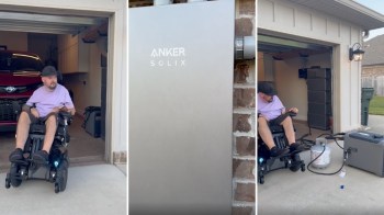 A person in a motorized wheelchair showing off a home battery system.