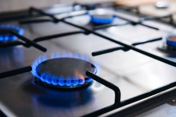 Lit burners on a gas stove.