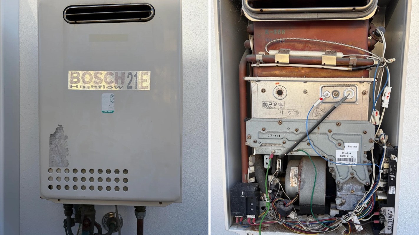 A gas water heater unit with visible brand label and internal components.