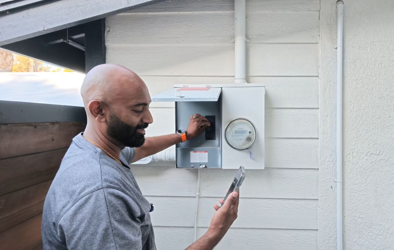 A person flipping a switch to go off-grid.