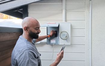 A person flipping a switch to go off-grid.