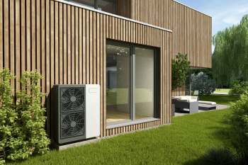 Heat pumps alongside a house.
