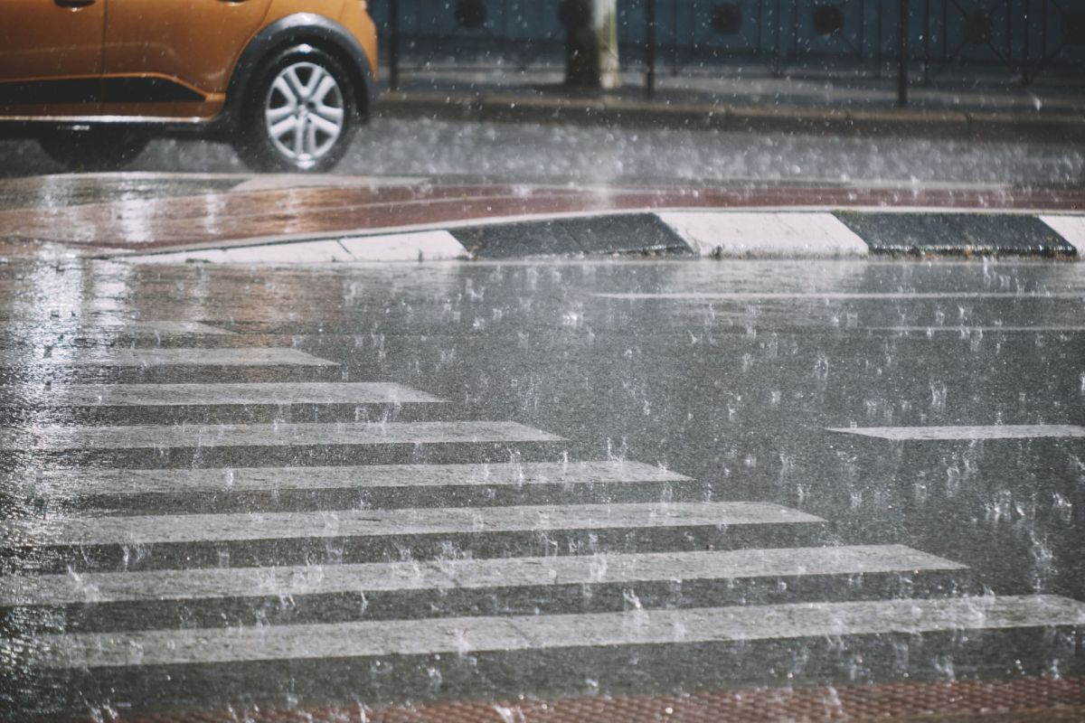 Heavy rain on a flooding street.