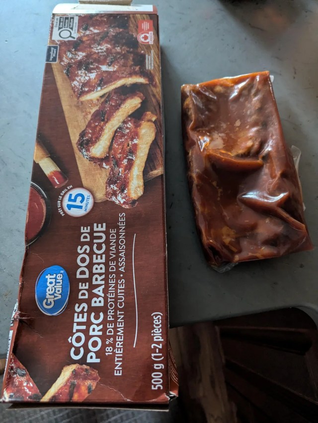 A package next to barbecue pork ribs less than half the size of the box.