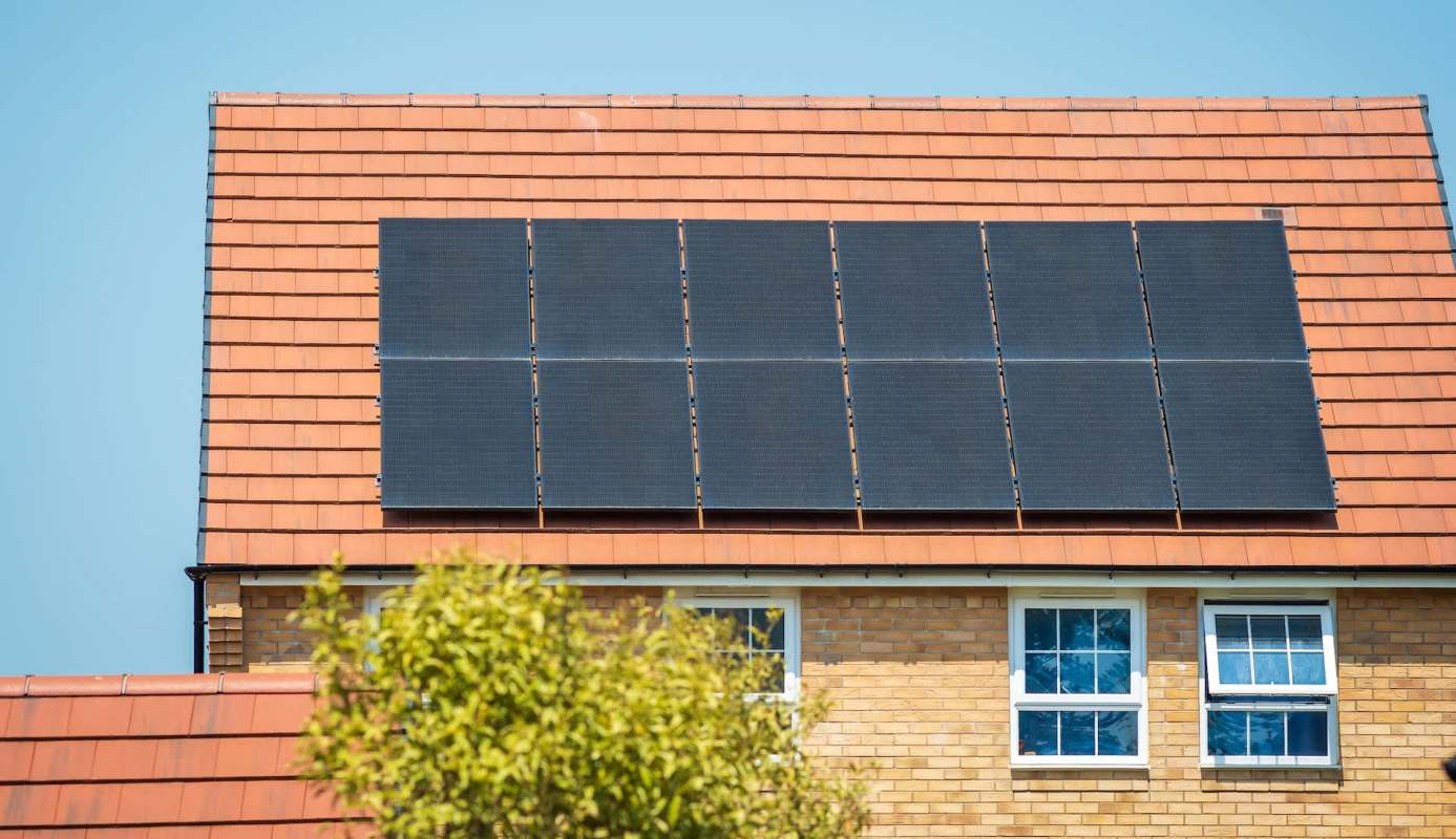 A house with rooftop solar panels.