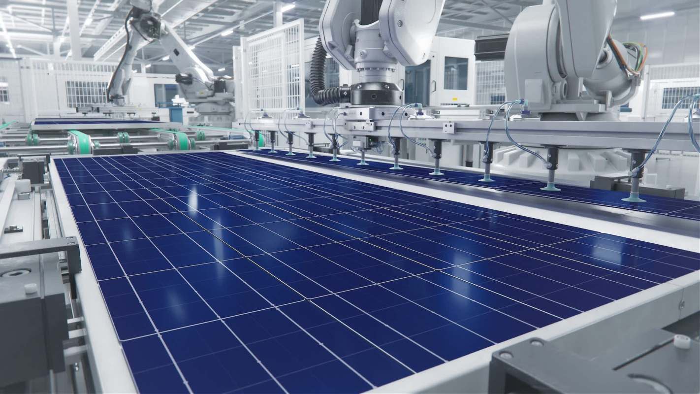 A manufacturing facility with robotic arms assembling solar panels on a conveyor.