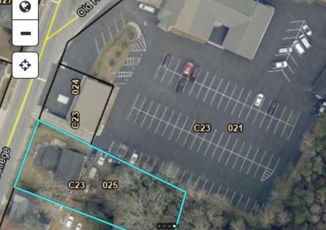 Aerial view of plot with house and funeral home.