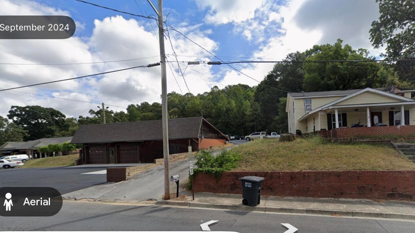 A house next to a funeral home.
