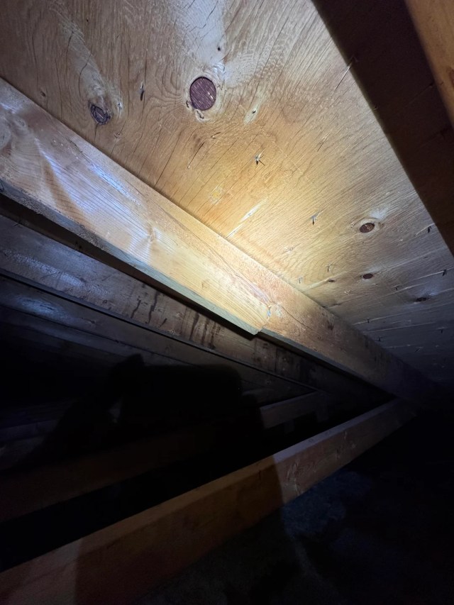 A cracked wooden beam.